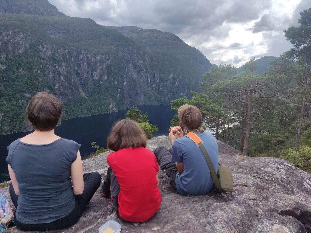 Our family sitting 200m over a fjord and watching the terrific view.